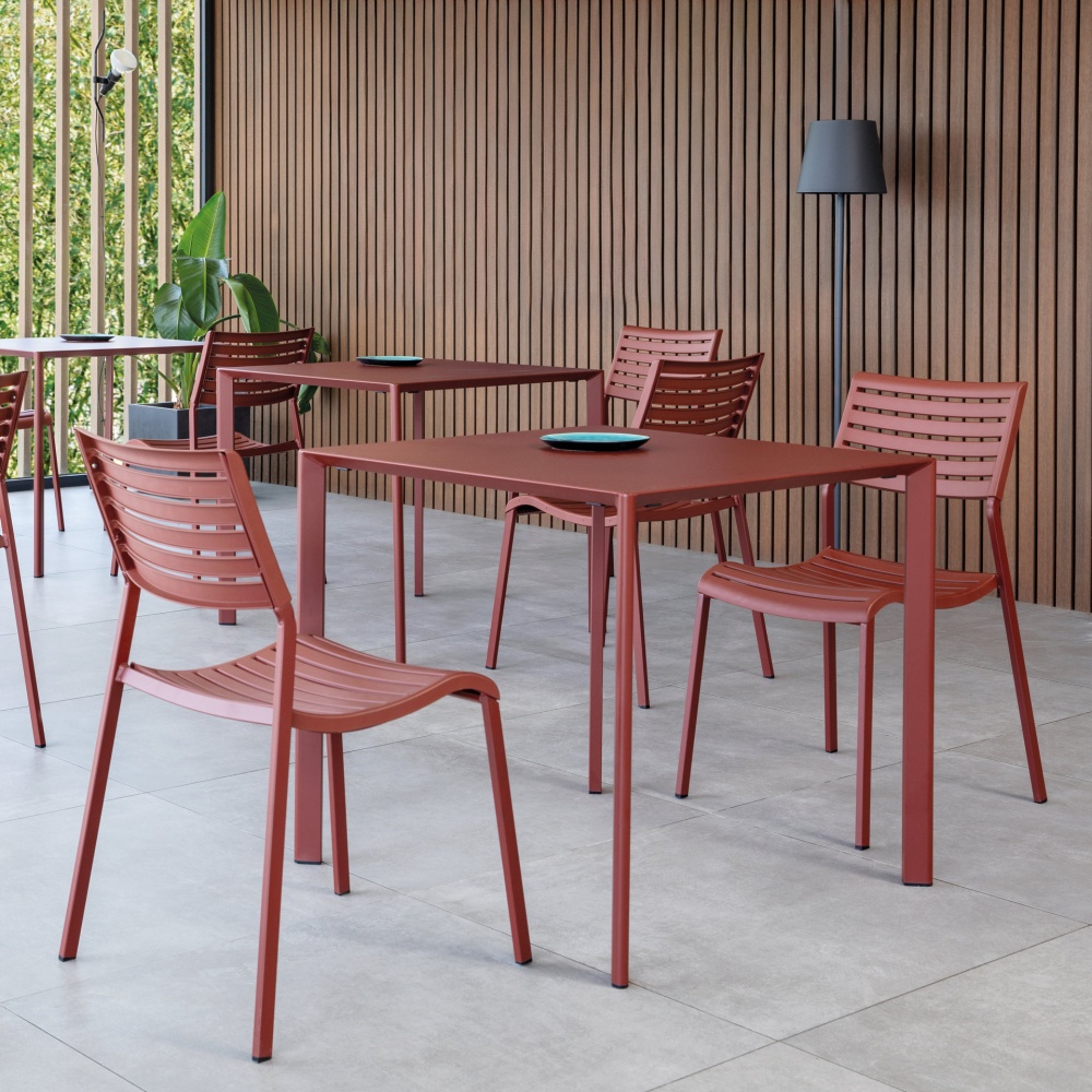 Stackable polypropylene chair with steel legs Nina