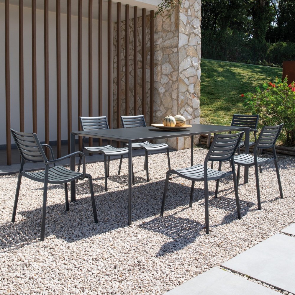 Stackable polypropylene armchair with steel legs Nina