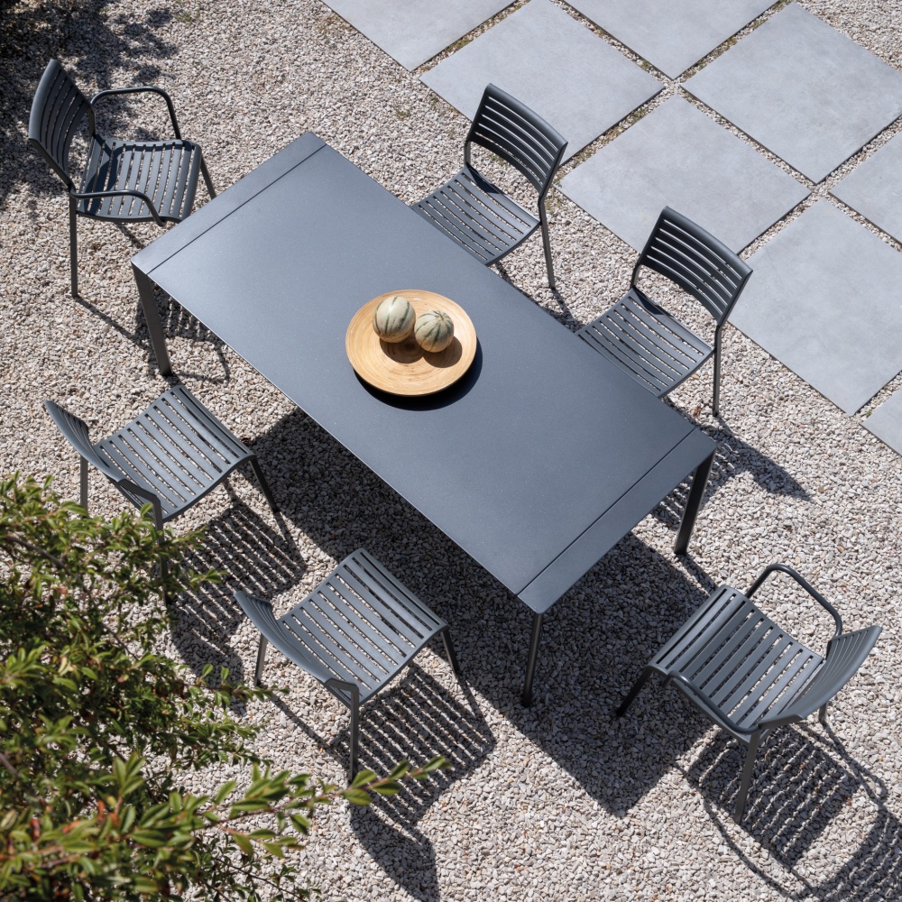 Stackable polypropylene armchair with steel legs Nina